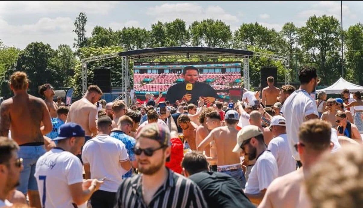 Packed crowd watching England live on the big screen at FanZone UK