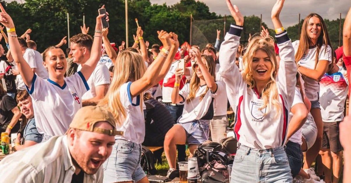 Outdoor crowd celebration at a FanZone UK World Cup fan zone