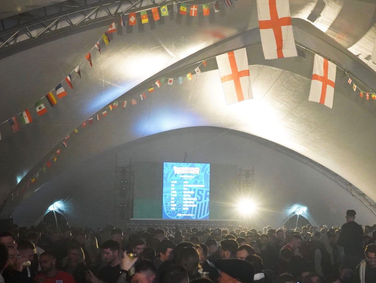 FanZone UK indoor venue decorated with England flags on matchday